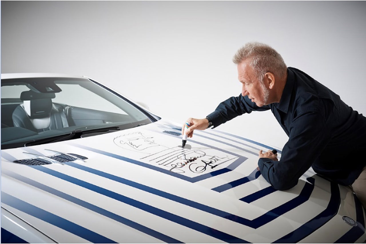 Jean-Paul Gautier signing his wrapped Mercedes-Benz SL-Class vehicle during <em>The Fashion World of Jean-Paul Gautier</em>