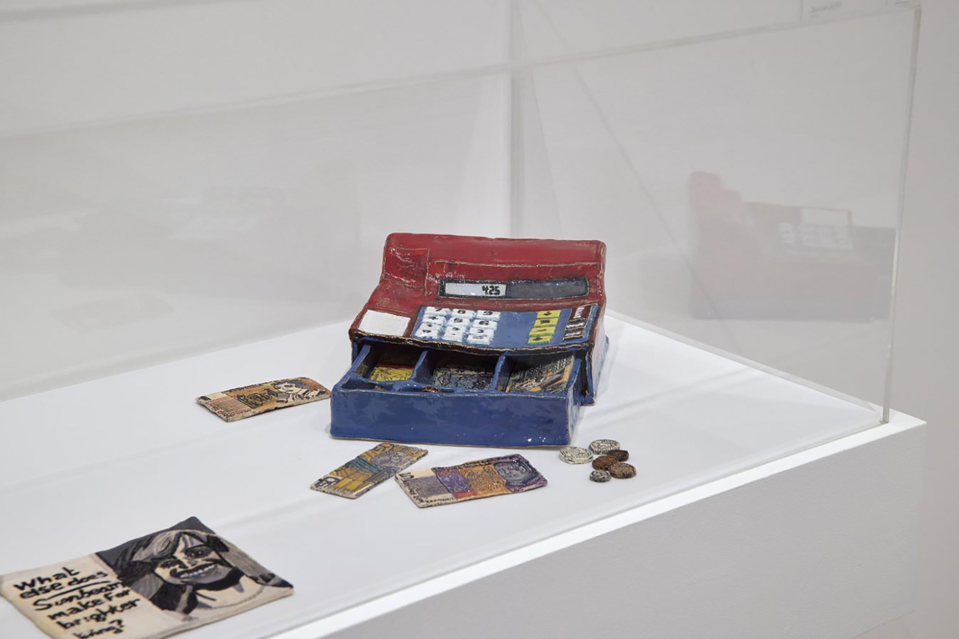 Installation view of Lisa Reid’s <em>The old fashioned cash register with the old paper dollar notes and coins</em> 2018 on display as part of the <em>Melbourne Now</em> exhibition at The Ian Potter Centre: NGV Australia, Melbourne from 24 March – 20 August 2023. Image: Sean Fennessy