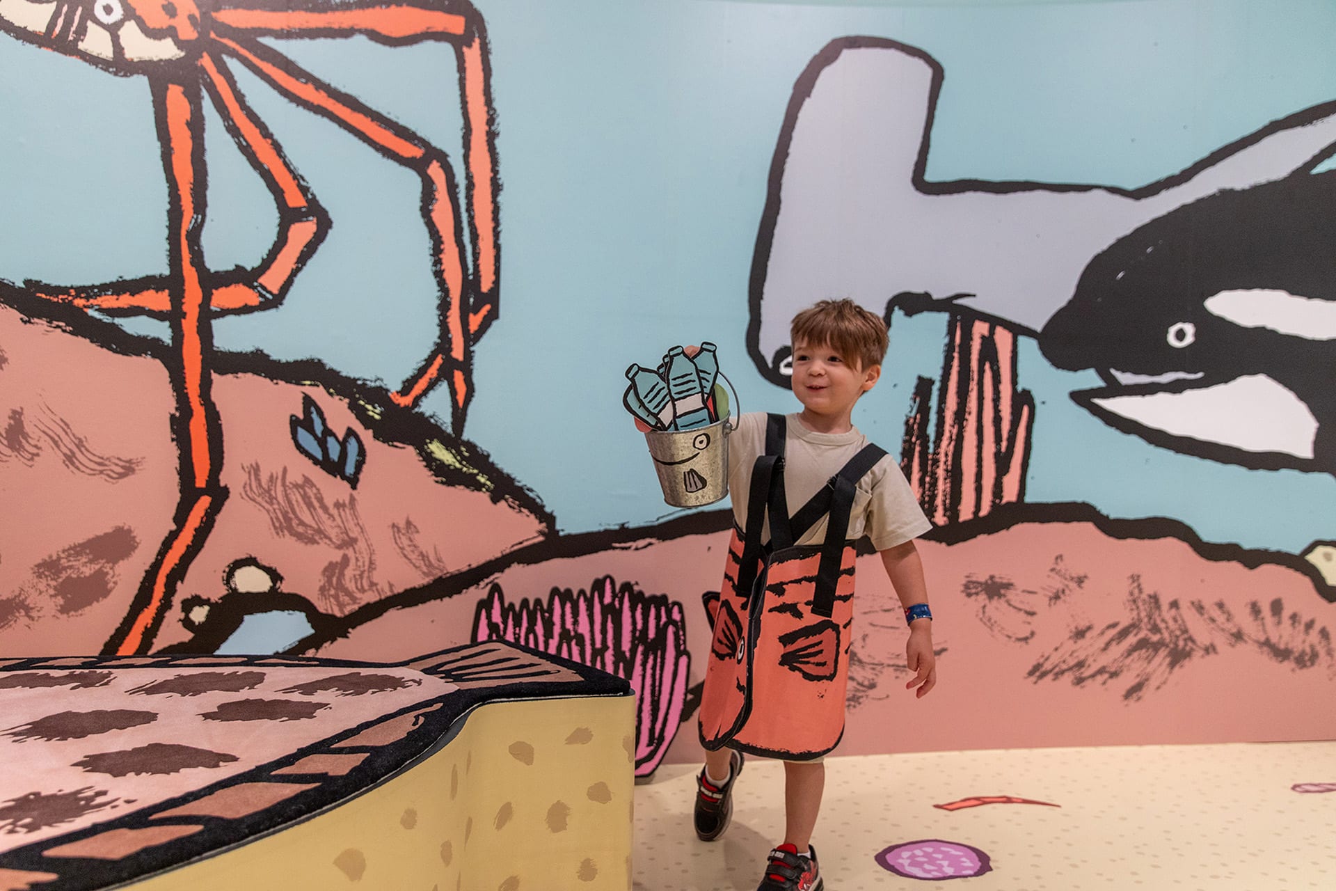 Young visitors enjoying <em>RIFIFI: Jean Jullien for Kids</em> on display as part of NGV Triennial  at NGV International, Melbourne. Photo: Kate Shanasy